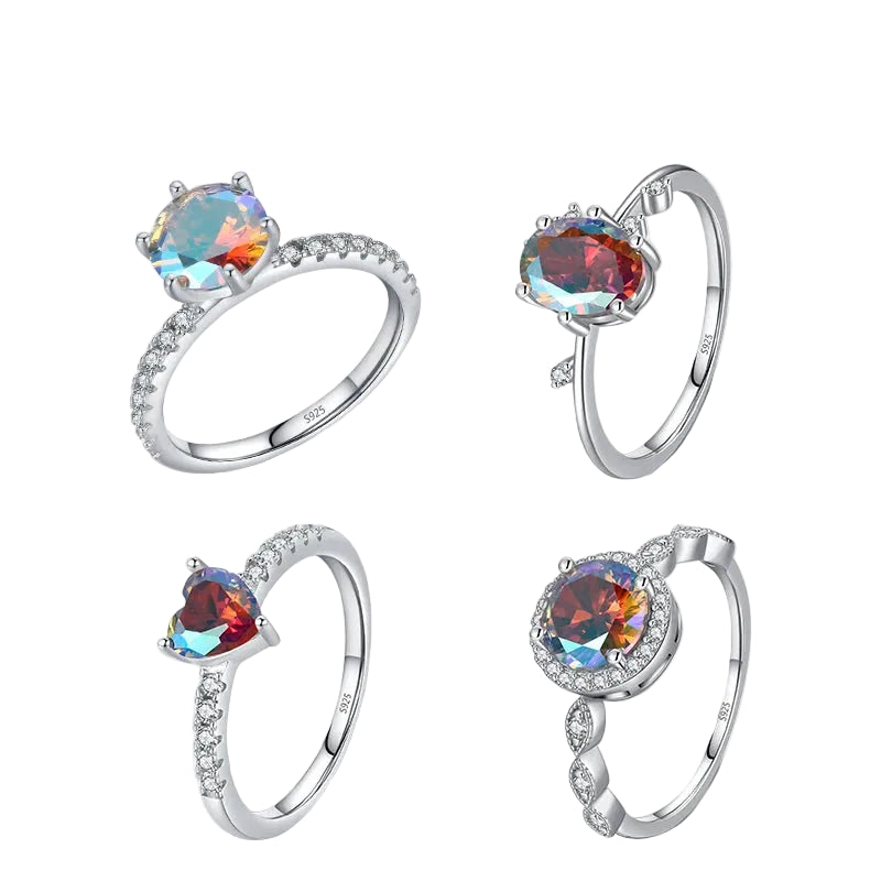 Four silver rings with colorful gemstones on a white background, featuring the brand 'HAT-HOR