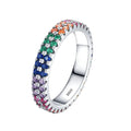 Silver ring with colorful gemstones on a white background