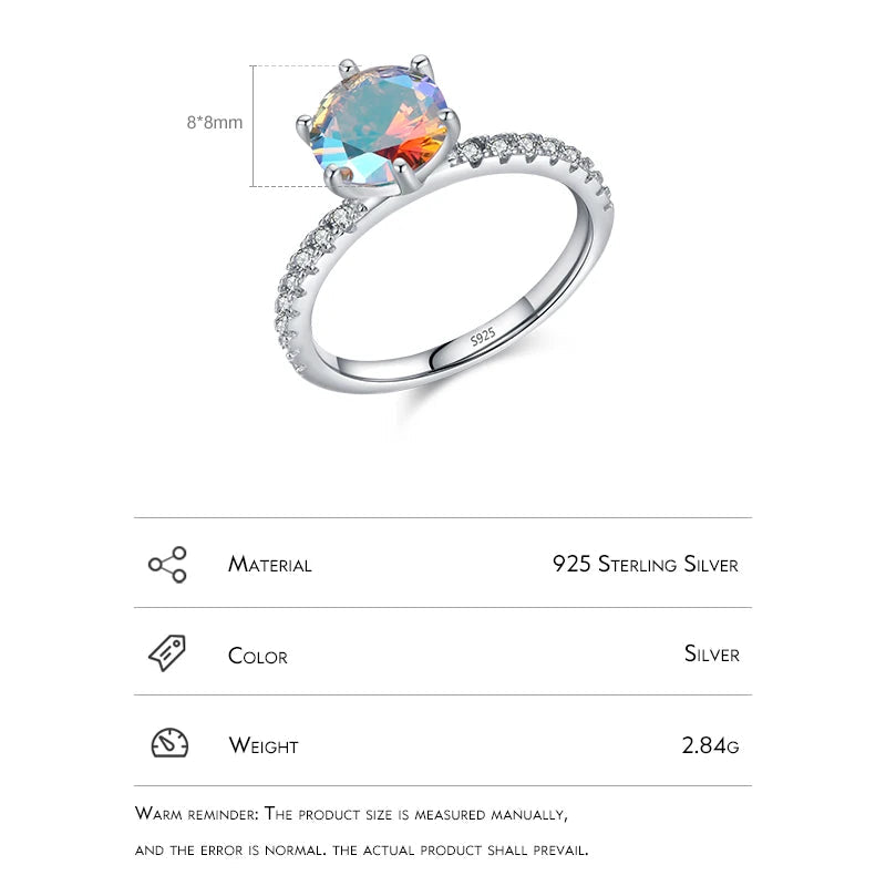 Silver ring with a colorful gemstone on a white background, featuring HAT-HOR branding.