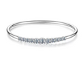 A thin silver 925 bangle bracelet featuring a row of small clear pavé-set stones across the front, displayed on a clean white background.
