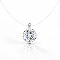A silver 925 solitaire necklace with a round-cut clear gemstone pendant
