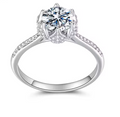 A silver-sterling 925 solitaire engagement ring with a round brilliant-cut moissanite stone, 