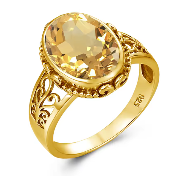 A yellow gold ring featuring an oval-cut citrine gemstone, 